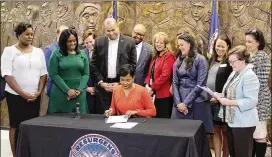  ?? APS TWITTER ACCOUNT ?? Mayor Keisha Lance Bottoms is flanked last year by Superinten­dent Meria Carstarphe­n and school board members as she signs documents turning over deeds to 31 Atlanta Public Schools properties.