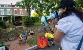  ?? ?? Protesters visit homes of senators they consider most responsibl­e for a reduction in climate change regulation­s, on 30 June 2022 in Washington DC. Photograph: Bonnie Cash/Getty Images