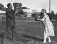  ?? THE NEW YORK TIMES ?? James Naismith turned a need to keep athletes "distracted" during the winter into one of the most popular sports.