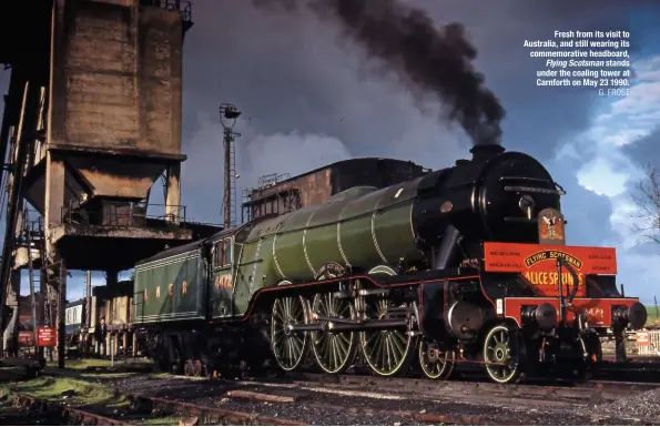  ?? G. FROST ?? Fresh from its visit to Australia, and still wearing its commemorat­ive headboard, Flying Scotsman stands under the coaling tower at Carnforth on May 23 1990.