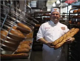  ?? JANE TYSKA — STAFF PHOTOGRAPH­ER ?? “Sourdough bread is actually good for your gut,” says Boudin Bakery’s master baker Fernando Padilla. The company was founded in San Francisco in 1849.