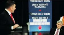  ?? NATHAN DENETTE /THE CANADIAN PRESS ?? Sheldon Kennedy, left, thanks Prime Minister Stephen Harper after Harper announced a planned Victims’ Bill of Rights in Toronto on Thursday.