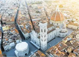  ?? MATTEO COLOMBO Getty Images ?? Aerial view of Duomo and campanile at sunset, Florence, Italy