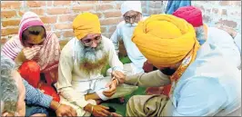  ?? —ANI ?? Congress leader Navjot Singh Sidhu meets the family of deceased farmer Lovepreet in Lakhimpur Kheri. Shiromani Akali Dal leader Harsimrat Kaur Badal also met the family separately on Friday.