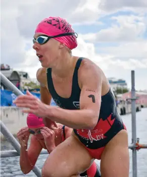 ??  ?? LEFT Guelph Triathlon Project success story Dominika Jamnicky taking the win at Camtri Bermuda ABOVE Jamnicky exiting the water in Bermuda
