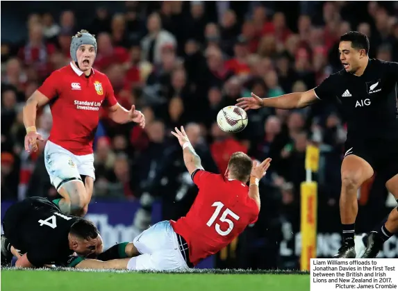  ??  ?? Liam Williams offloads to Jonathan Davies in the first Test between the British and Irish Lions and New Zealand in 2017.
Picture: James Crombie