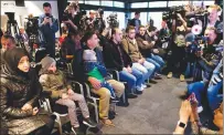  ?? AP PHOTO ?? Syrians brought to The Hague by Russia in a move to discredit reports of an April 7 chemical weapons attack in the Syrian town of Douma take their seats at a press conference in The Hague, Netherland­s, Thursday.