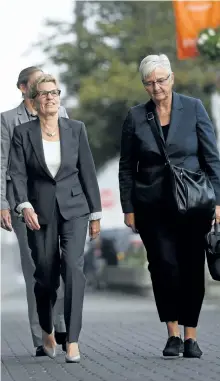  ?? SEAN KILPATRICK/THE CANADIAN PRESS ?? Ontario Premier Kathleen Wynne, left, accompanie­d by her partner, Jane Rounthwait­e, arrives to appear as a witness in the Election Act bribery trial in Sudbury, Ont., on Wednesday.