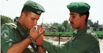  ?? (Reuters) ?? AFTER THE Oslo Accords a Palestinia­n lights a cigarette for an IDF solder. The days of Oslo are over, it’s time for a different mindset.