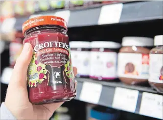  ?? DOUG IVES THE CANADIAN PRESS ?? Crofter’s organic raspberry jam could benefit if Canadian shoppers buy locally as a result of a trade war.