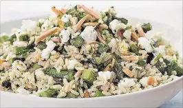  ?? CARL TREMBLAY THE ASSOCIATED PRESS ?? This appealing side salad includes crisp, browned bites of asparagus, lemon juice, creamy goat cheese and crunchy toasted almonds.