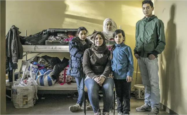  ?? Mauricio Lima / The New Yo rk Times ?? Hivrun Kurdi with her children in the shelter where they were living recently in Bramsche, Germany. The death of three-year- old Alan Kurdi, which
focused the world on refugees, was just one chapter of a sprawling family’s story in its desperate...