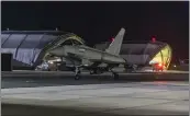  ?? SGT LEE GODDARD — U.K. MINISTRY OF DEFENCE AP ?? A British Royal Air Force Typhoon aircraft returns to base Friday at RAF Akrotiri in Cyprus after striking targets in Yemen, part of coordinate­d strikes led by the United States.