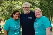  ??  ?? LEFT: Angel James (left), Cancer Navigators’ service navigator manager, and Scharla Battle (right), Cancer Navigators’ community outreach manager, congratula­te Allen Stephens and the Floyd Medical Center oncology department for raising $12,454.88 during the fundraiser.