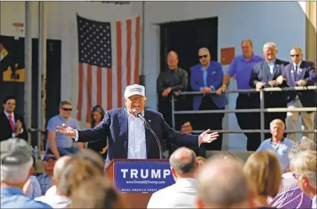  ?? Robert F. Bukaty Associated Press ?? DONALD TRUMP, then a candidate, speaks at a 2016 campaign event at the former Osram Sylvania lightbulb plant in Manchester, N.H.