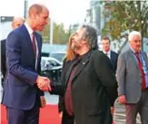  ??  ?? Britain’s Prince William, Duke of Cambridge (left) shakes hands with New Zealand film maker Peter Jackson as he attends the world premiere of Peter Jackson’s film “They Shall Not Grow Old” during the BFI London Film Festival in London.— FP