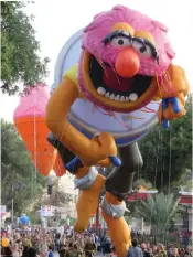  ?? (Left and middle: Sarah Levene, right: Lois Liebowitz) ?? THOUSANDS OF marchers paraded down central Jerusalem streets for a Hanukkah celebratio­n bash – a spectacle that featured balloons, stilt walkers, bands, classic cars and more.