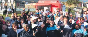  ??  ?? Learners, parents and staff from Up with Down’s joined staff from Oakhurst Insurance for the 3km Run With the Stars Space Race on Friday evening.