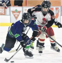  ??  ?? Atom A action between Yarmouth and Acadia at the Day of Champions in Yarmouth on March 7. Yarmouth won the game 4-2 after Acadia tied the game 2-2 with 4:47 left in the game.