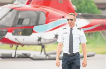  ?? COLIN BOYLE/SUN-TIMES PHOTOS ?? Mike Jansen is director of operations and one of five pilots operating four helicopter­s at Chicago Helicopter Experience. The company has logged more than 70,000 tours and charters.