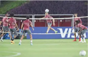  ?? (AFP) ?? Qatar’s defender Bassam al-Rawi (centre) heads the ball during a training session at the Aspire Training Pitch in Doha yesterday, ahead of the hosts World Cup match against Ecuador.