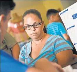  ?? PHOTOS BY JASPER COLT/USA TODAY ?? Eva Medina has her blood pressure checked at a community center in the Mameyes neighborho­od of Jayuya, where a temporary clinic provides basic medical services.