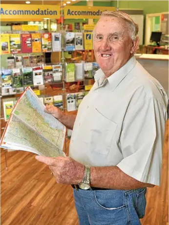  ?? Photo: Kevin Farmer ?? HONOURED: Bruce Moore has resigned after volunteeri­ng for 30 years at Toowoomba Visitor Informatio­n Centre.