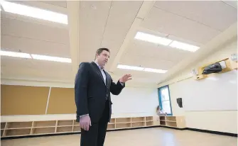  ??  ?? Greater Victoria school district secretary treasurer Mark Walsh gives a tour of Quadra Elementary’s new “learning studio.” Two similar units are about to open at Willows Elementary.