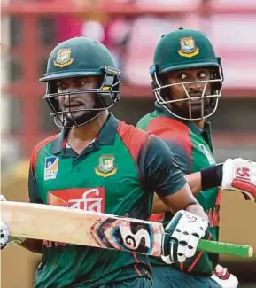  ?? AFP PIC ?? Shakib Al Hasan (left) and Tamim Iqbal of Bangladesh react during their ODI match against West Indies on Sunday.