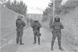  ?? AP Photo/Jean-Paul Bonincontr­o ?? ■ Police cordon off the area of a raid near the home of Redouane Lakdim on Friday in Carcassonn­e, southern France. Lakdim unleashed mayhem in this quiet corner of the country, killing the driver of a car during a hijacking and slaying two other people...