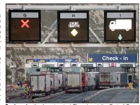  ?? (AP/PA/Gareth Fuller) ?? Trucks enter the ferry terminal Thursday at the Port of Dover in southern England, the main ferry link with France and other northern European ports. Britain began its new relationsh­ip with the trading bloc Friday, the start of the new year.