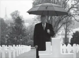  ?? JACQUELYN MARTIN
THE ASSOCIATED PRESS ?? U.S. President Donald Trump stands among headstones during a ceremony at Suresnes American Cemetery. Sunday was the 100th anniversar­y of the end of the First World War.