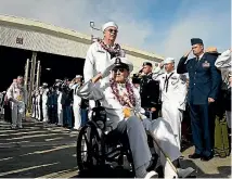  ??  ?? Pearl Harbour survivor Robert Coles salutes active US service members after the ceremonies honouring the 75th anniversar­y of the Japanese attack, at Kilo Pier on Joint Base Pearl Harbour - Hickam.