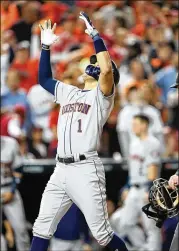  ?? DOUG MILLS / NEW YORK TIMES ?? Houston’s Carlos Correa celebrates his two-run homer in the fourth inning of Game 5 of the World Series, a 7-1 victory over the Washington Nationals.