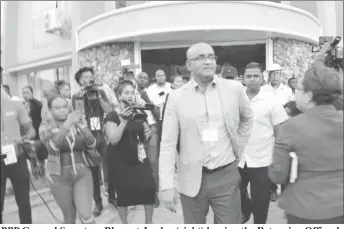  ??  ?? PPP General Secretary Bharrat Jagdeo (right) leaving the Returning Officer’s office at High and Hadfield streets yesterday after the spreadshee­t matter was resolved