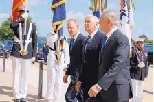  ?? EVAN VUCCI/ASSOCIATED PRESS ?? Vice President Mike Pence, center, is greeted by Deputy Secretary of Defense Pat Shanahan, left, and Secretary of Defense Jim Mattis before speaking at an event on the creation of a U.S. Space Force.