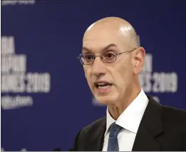  ?? JAE C. HONG — THE ASSOCIATED PRESS, FILE ?? NBA Commission­er Adam Silver speaks at a news conference on Oct. 8 in Saitama, Japan. A person familiar with the negotiatio­ns says the NBA is working with the players’ union and its teams on a plan to shorten the regular season, possibly to 78games.