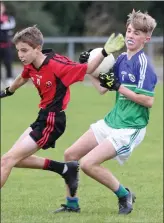  ??  ?? Liam Cooney evades Cian Cummins in Glynn-Barntown’s 4-4 to 0-8 win over Bannow-Ballymitty in last year’s New Ross Standard Under-13 football Division 2 championsh­ip final.