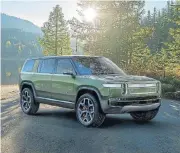  ??  ?? The Rivian R1S all-electric seven-seater SUV.