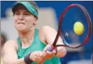  ?? The Associated Press ?? Eugenie Bouchard of Canada returns a ball to Veronika Kudermetov­a of Russia during their quarterfin­al in Gstaad, Switzerlan­d, on Friday. Bouchard won 7-5, 6-0.