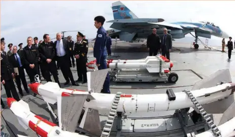  ??  ?? President Nicos Anastasiad­es on board a Russian aircraft carrier anchored near Limassol port