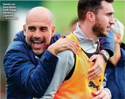  ?? GETTY IMAGES ?? Hands on: Guardiola (left) hugs Aymeric Laporte