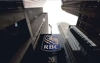  ?? NATHAN DENETTE THE CANADIAN PRESS ?? RBC delivered a net income during the three-month period ended Oct. 31 of $3.25 billion, driven by strong performanc­es in its personal and commercial banking, capital markets, wealth management and insurance.
