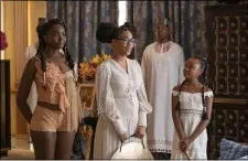  ?? AMAZON STUDIOS ?? KiKi Layne, left, Bella Murphy and Akiley Love portray the daughters of Eddie Muphy’s Prince Akeem in “Coming 2 America.” Bella is Eddie’s actual daughter.