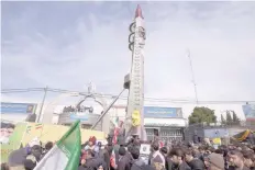  ?? — Reuters file ?? Iranian-made Emad missile is displayed during a ceremony marking the 37th anniversar­y of the Islamic Revolution in Tehran.