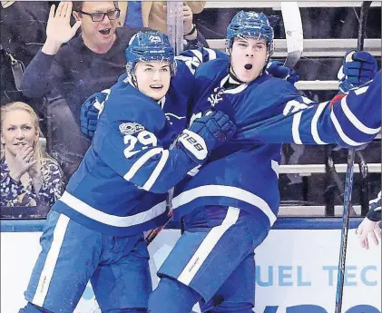  ?? CP PHOTO ?? Toronto Maple Leafs’ Auston Matthews (right) and teammate William Nylander celebrate after Matthews’ second goal during NHL action against the Montreal Canadiens in Toronto on Saturday.