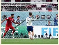  ?? GETTY IMAGES ?? Jack Grealish eases the ball into an empty net to score England’s sixth and final goal in their 6-2 win over Iran at the World Cup.