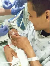  ?? PROVIDED PHOTO ?? Yovani Lopez holds his son at Christ Medical Center.