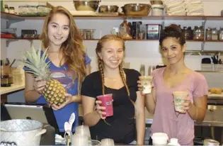  ?? The Maui News / CARLA TRACY photo ?? Maka by Mana’s creative raw-bar team includes Ashley Cutler (from left), Tiare Ventura and Alohilani Iwankew serving fresh fruits, smoothies and other healthful fare since January.