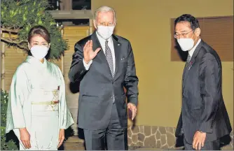  ?? AP ?? Japanese Prime Minister Fumio Kishida (right) and his wife Yuko Kishida welcome US President Joe Biden at Hoppoen garden for dinner in Tokyo, Japan, on Monday.